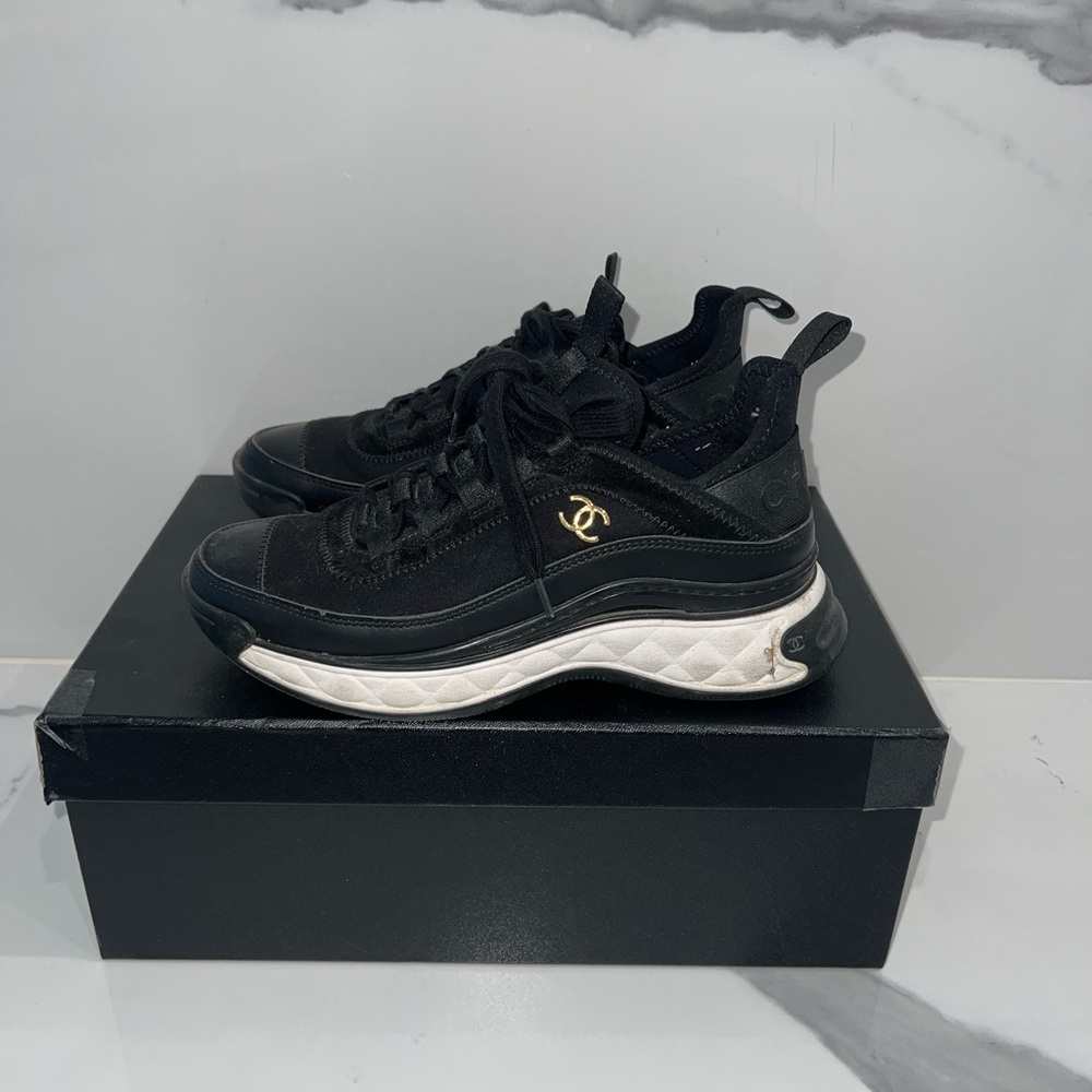 Black and White Sneakers with Gold Logo